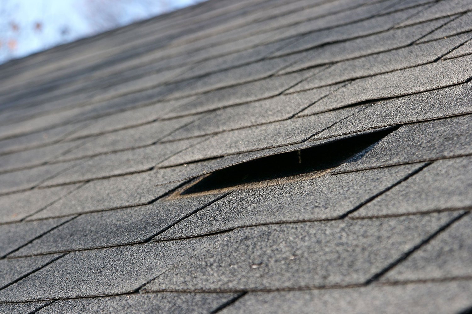 loose shingle left by previous contractor